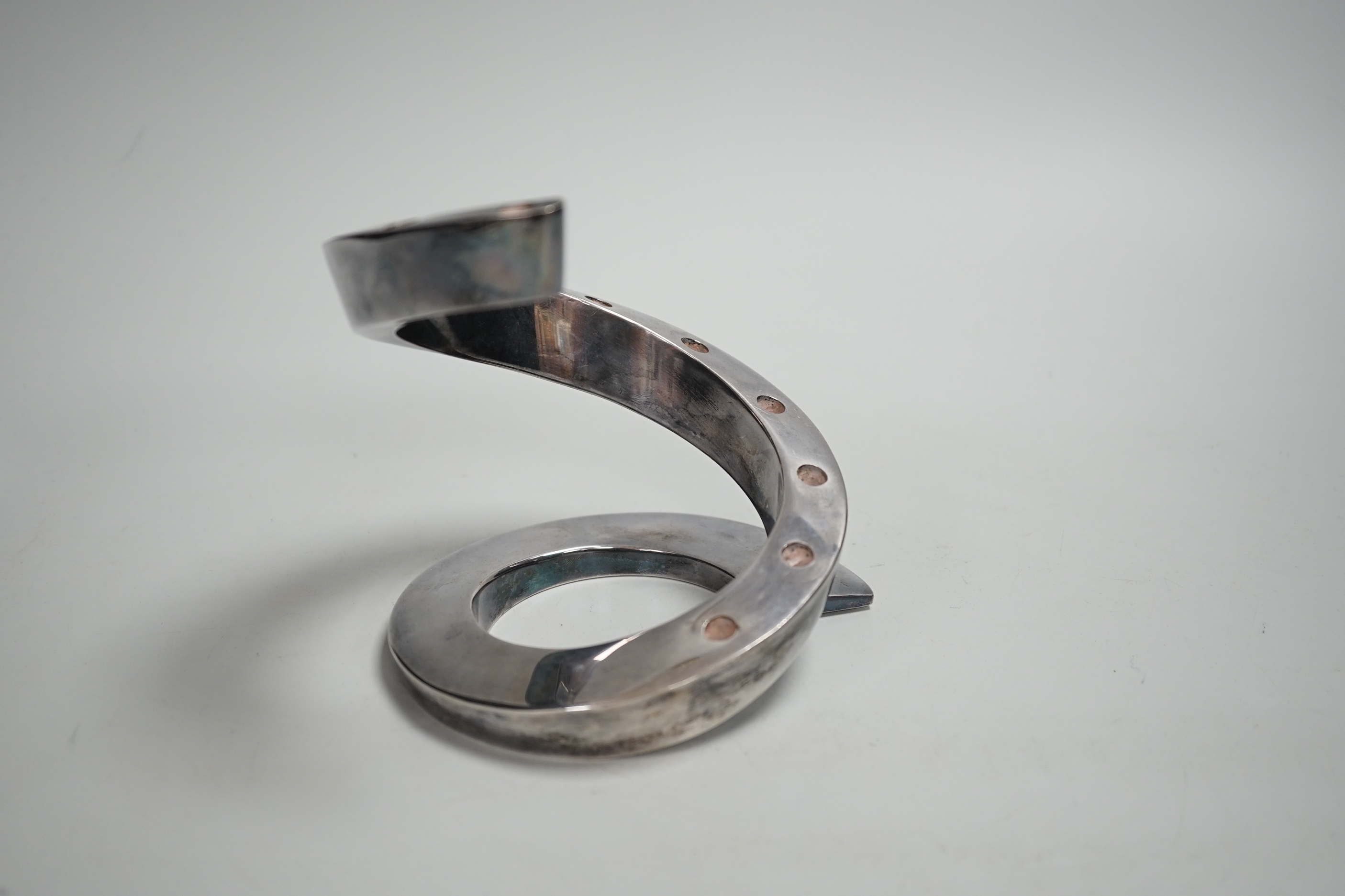 A contemporary Danish style coiled candlestick in chrome finish, stamped Dansk Designs France BV, 13.3cm high